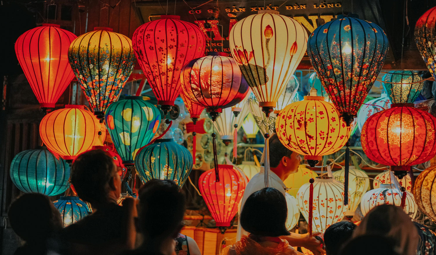 Asian arts & culture, people buying lanterns, Photo by Min An: https://www.pexels.com/photo/people-standing-near-assorted-color-lamps-1102305/